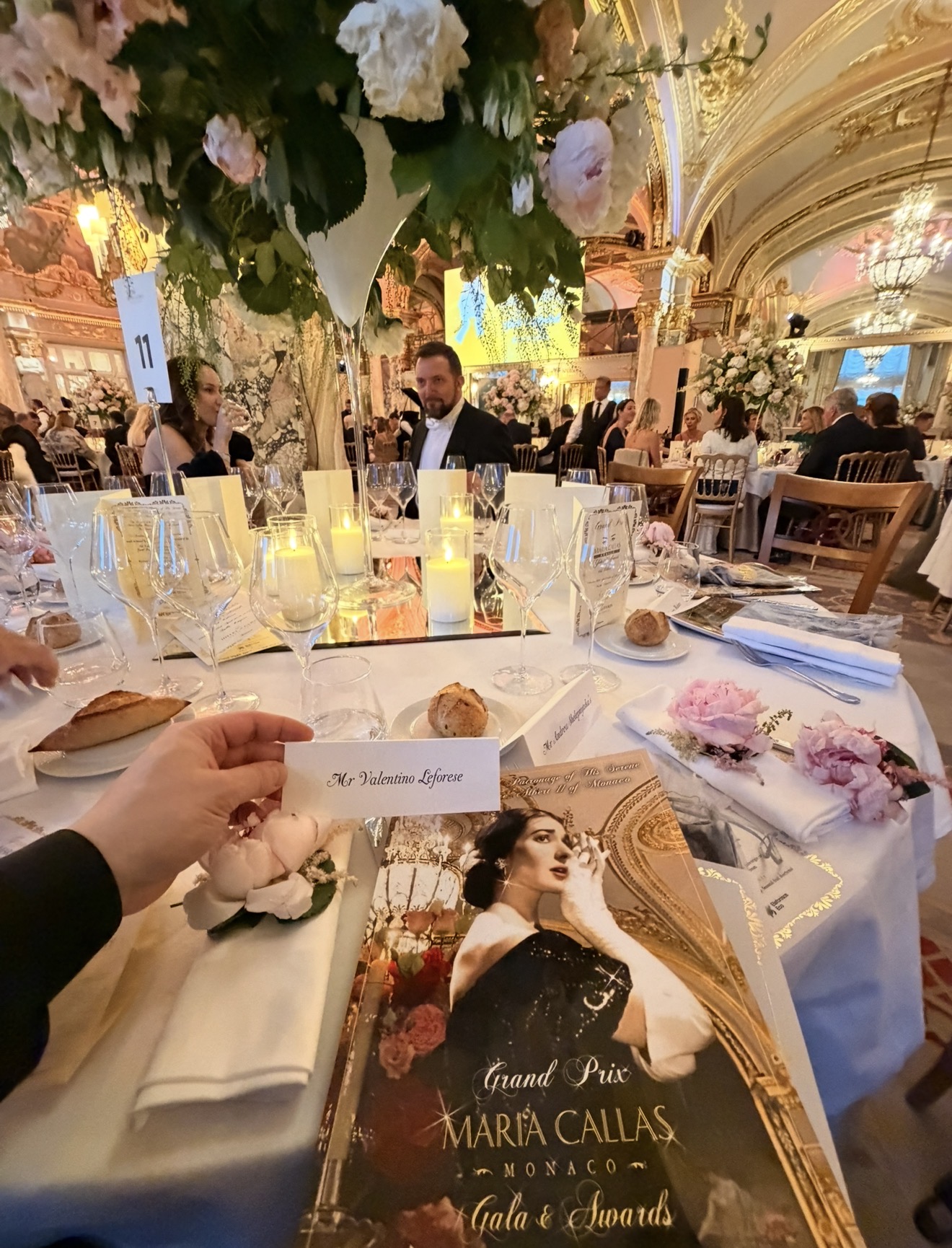 Maria Callas gala programme and a Valentino Loforese place card at a candlelit table